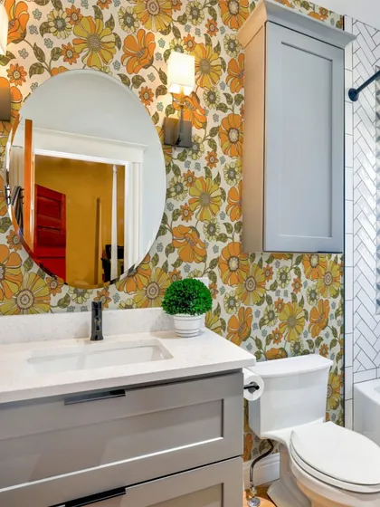 A bathroom featuring our Crimson Daisies Floral Pattern wallpaper is full of fun and personality. The playful design and bright colors make for a cheerful and uplifting space.