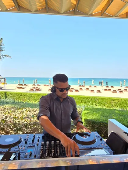 Setting the vibe for a beachside sundowner in Dubai. My work takes me to the most beautiful locations, and I specialize in creating the perfect soundtrack for any destination event, whether it's a relaxed brunch or a high-energy party.