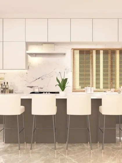The kitchen in our modern luxury villa in Pune. It features a large island with seating for four, sleek two-toned cabinets, and built-in appliances for a clean, minimalist look.