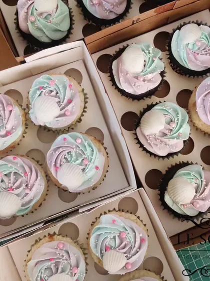 Mermaid-themed cupcakes for a magical celebration. I used a mix of pastel pink and blue buttercream to create a two-tone swirl, then topped them with sprinkles and a white chocolate seashell.