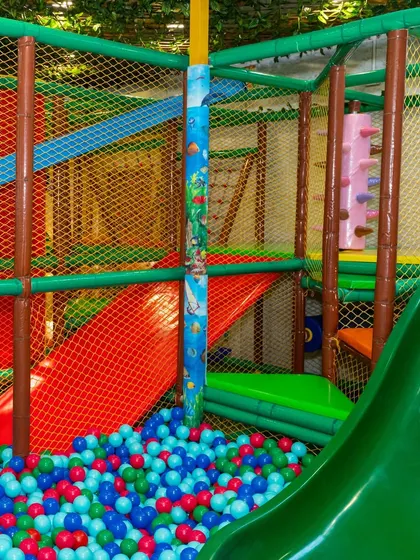 Our play structure includes various tunnels and levels to explore, all visible through the safety netting so parents can keep an eye on their children.