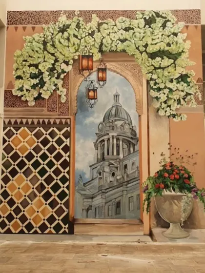 Step into Spain without leaving the country. This larger-than-life mural was created for a villa clubhouse, featuring a grand Spanish-style doorway, beautiful architecture, and vibrant flowers to transport residents to the sunny vistas of Valencia.