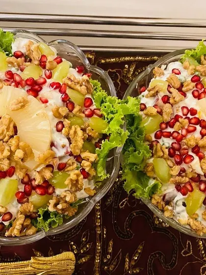 A close-up of the vibrant Russian Salad, showing the mix of textures and colors from the fresh ingredients.