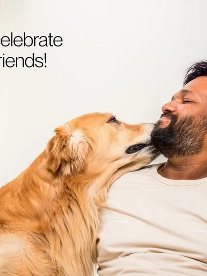 A golden retriever giving his human a sweet kiss to celebrate International Dog Day.
