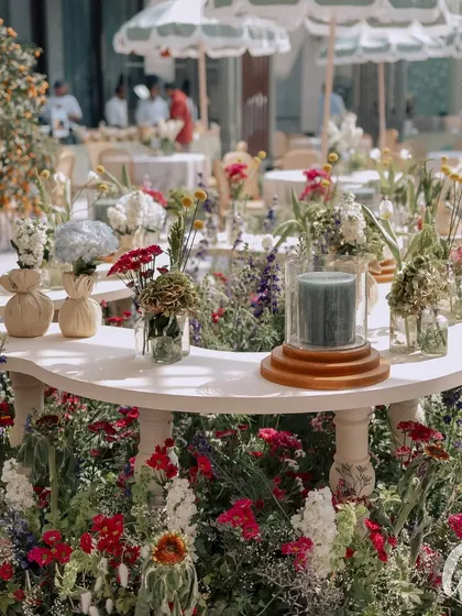 We designed this unique floral bar where the counter itself is a garden bed. This immersive installation allows guests to be surrounded by flowers while they order their drinks.
