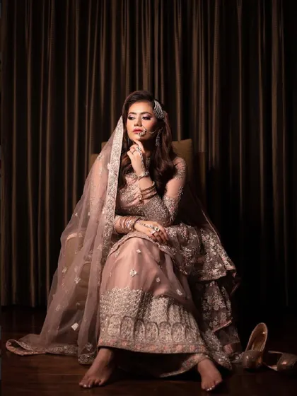 "Kya haseen tasveer ho tum." A beautifully captured moment of my bride looking thoughtful and elegant in her dusty pink reception outfit.