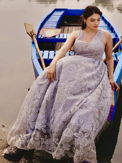 For this editorial boat shoot, I designed a voluminous gown with a delicate floral lace overlay. The design contrasts beautifully with the rustic setting, creating a soft, romantic mood.