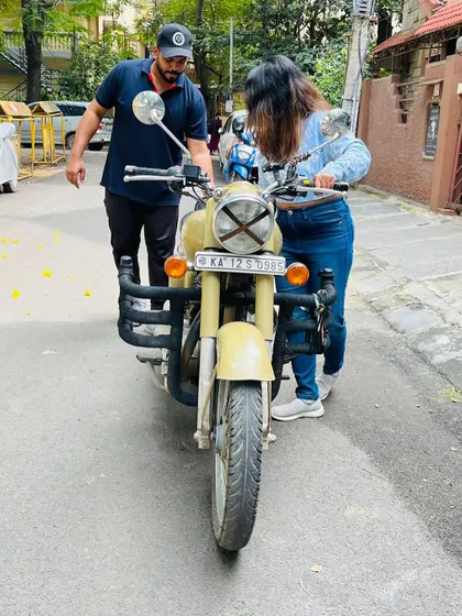 Helping a student get a feel for the bike's balance. This is a critical first step before even starting the engine.