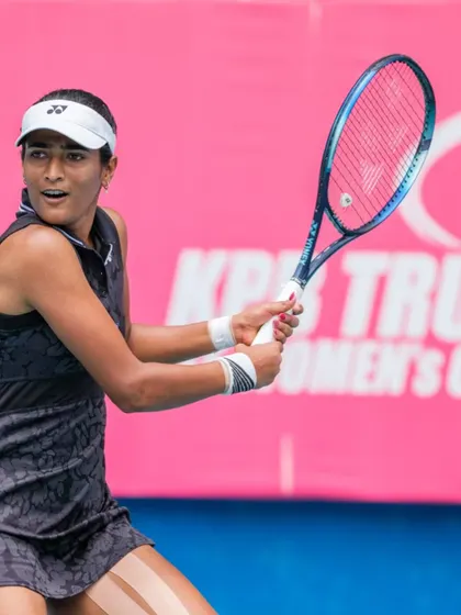 Rutuja Bhosale prepares to return a serve, demonstrating the ready position and sharp focus we instill in all our high-performance athletes.