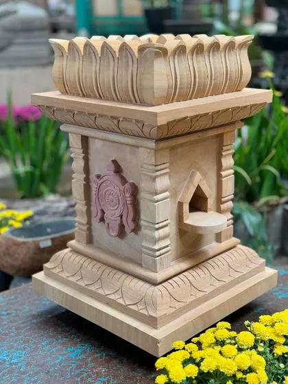 Our Shanku Chakra Nama Brindavan in sandstone, a sacred piece that showcases rich cultural heritage and symbolizes cosmic harmony.