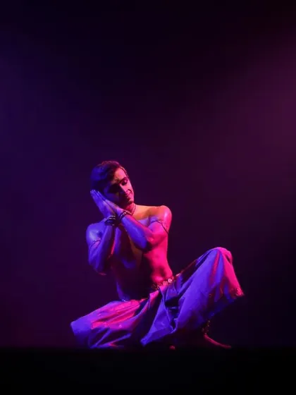 A moment of quiet contemplation from my 'Shivanjali' performance. The purple lighting creates a serene and spiritual mood.