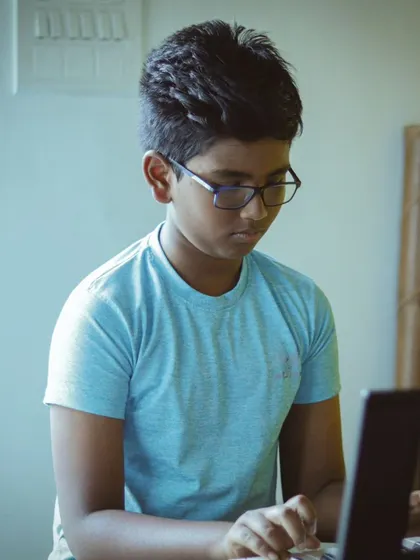 A student focused on his keyboard performance. Our recitals are a celebration of musical journeys.
