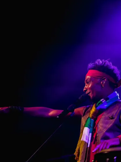 A dynamic shot of David Walters, pointing towards the audience during his concert. His engaging stage presence and connection with the crowd are palpable in this photo.