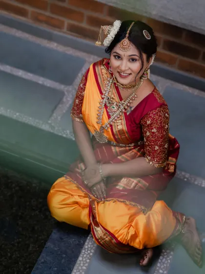 A unique portrait of the bride, looking happy and confident. The makeup is flawless, highlighting her beautiful features.