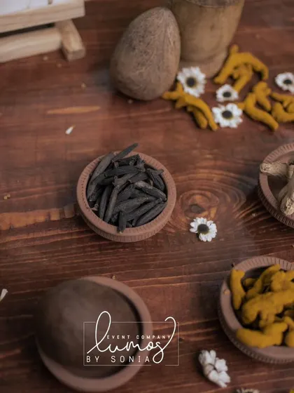A detailed view of the various spices and herbs used in a traditional Haldi ceremony.
