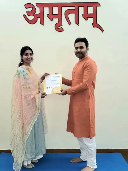 Presenting a 200-hour YTTC certificate to a dedicated student. We wish her immense success as she steps into the role of a yoga teacher.