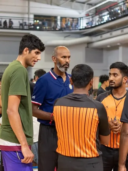 Our lead basketball coach, Capt. Prasad, strategizes with players and officials during our 3x3 basketball tournament.