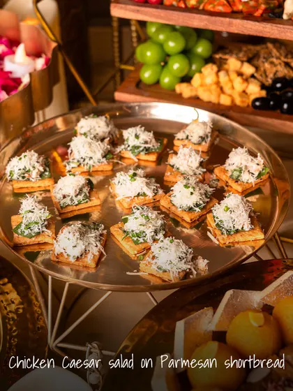 A creative take on a classic salad. This Chicken Caesar Salad is served on a savory Parmesan shortbread, offering a delightful mix of creamy, crunchy, and cheesy in one perfect bite.