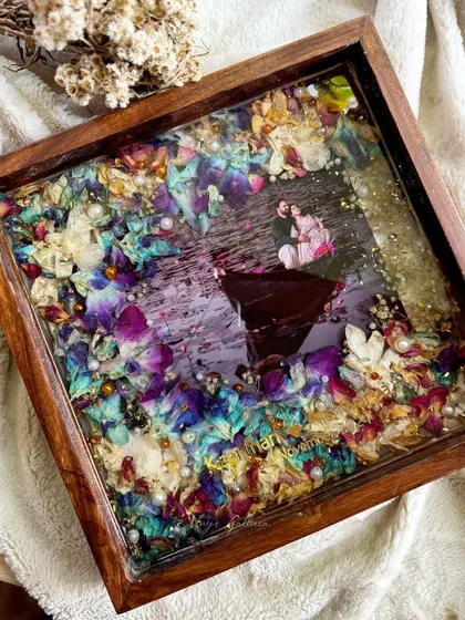 This angle showcases the depth and clarity of the resin, with the preserved orchids and photo creating a beautiful, multi-dimensional effect within the wooden frame.