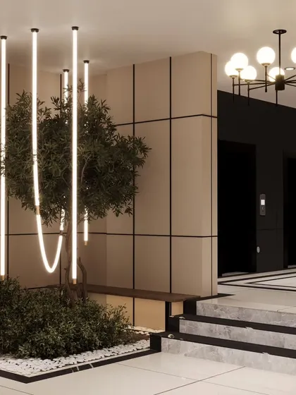 A close-up of the indoor planter and seating nook. We love bringing natural elements indoors to create a sense of calm. The combination of the olive tree, modern lighting, and clean lines defines this space.