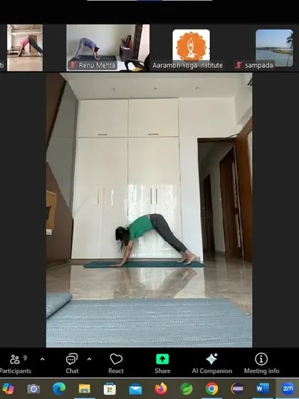 An instructor demonstrates Adho Mukha Svanasana (Downward-Facing Dog) in our online workshop. This foundational yoga pose stretches the entire body, calms the brain, and helps to relieve stress, making it a key part of our holistic weight management program.
