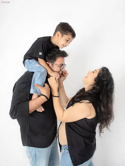 Pure, unscripted joy! I love capturing these candid family moments, like a big brother playing with his parents, all laughing together as they await the new arrival. These are the memories you'll treasure forever.