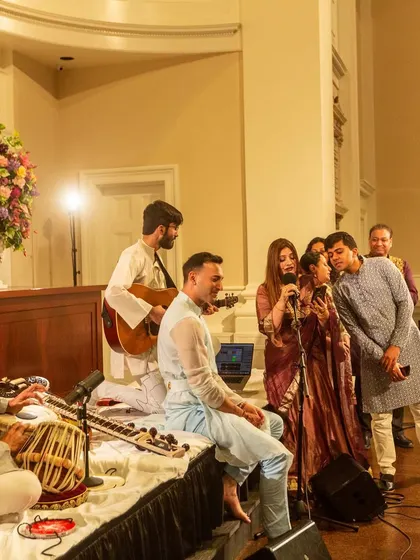 Audience members joining us on stage for a song. My shows are interactive, and I love creating a sense of shared celebration.