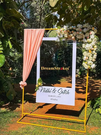 This personalized photo frame stand is a fun and interactive decor piece for guests, customized for the couple's special day.