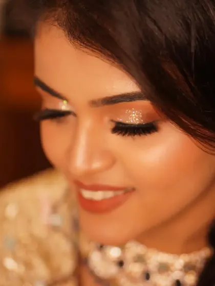 A close-up detail of the diamond glitter on Payal's eyelids. This macro shot shows the precision and artistry that goes into creating a truly sparkling reception look.