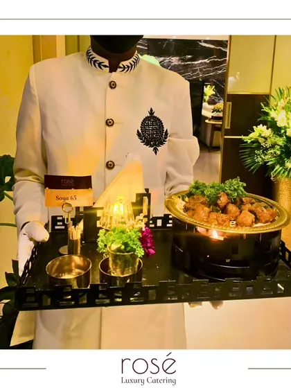 A server presents our Soya 65 appetizer, a spicy and flavorful vegetarian dish. It's served on a personal warmer to ensure it stays hot and delicious.