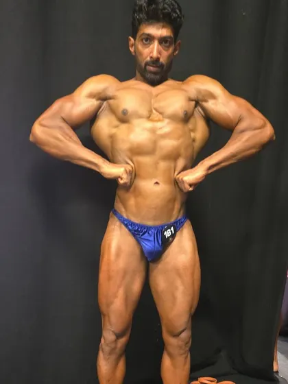 Front lat spread, a key pose to display symmetry and width. This is the result of dedicated prep.
