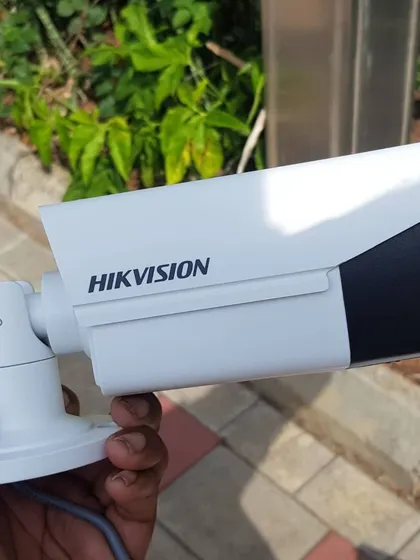 A side profile of a Hikvision bullet camera, showing its durable, weatherproof housing.