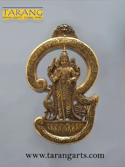 This unique brass wall hanging features Lord Murugan within the sacred 'Om' symbol. It's an exquisitely crafted piece that combines divine imagery with spiritual symbolism, perfect for any wall.