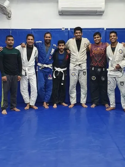 Standing with some of my students. As a coach, my goal is to guide them in understanding not just the moves, but the concepts and feelings that make Jiu-Jitsu a lifelong practice.