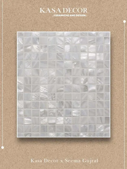 A close-up of our Mother of Pearl mosaic tile. The delicate shimmer and soft luminosity of the material create a gentle interplay of texture and reflection, offering beauty in its most graceful form.