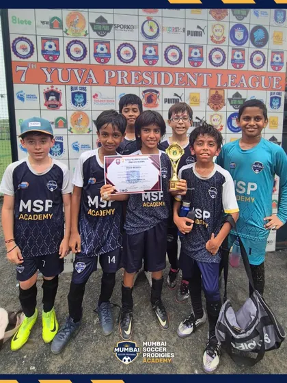 The U11 team celebrates with their trophy after a successful tournament.