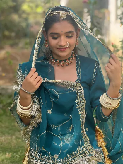 Embracing the royal heritage of Rajasthan. This look features traditional Rajasthani elements, with vibrant colors and ethnic jewelry for an authentic feel.