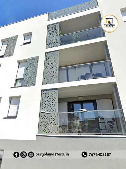 For this apartment building facade, we fabricated and installed decorative perforated panels alongside glass railings. These screens add a modern design element while providing privacy for the balconies without completely blocking light.