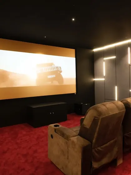 The large screen is perfect for action movies, with the powerful sound system to match. This setup features OSD Black speakers and a REL subwoofer for deep, impactful bass.