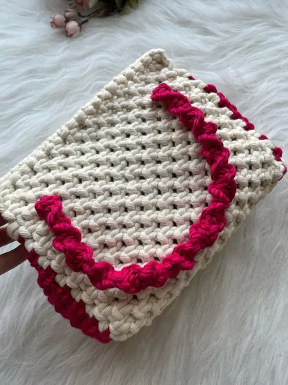 For a brighter look, this version combines a classic off-white body with a vibrant pink trim and handle. It's a fun and feminine choice.