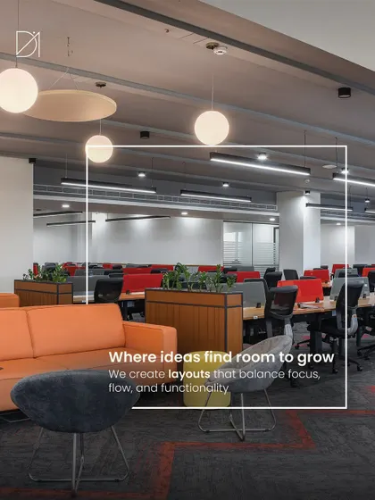 A successful office layout balances focus, flow, and functionality. This view shows a mix of open workstations with pops of color and a nearby lounge area, providing employees with choices for how and where they work.