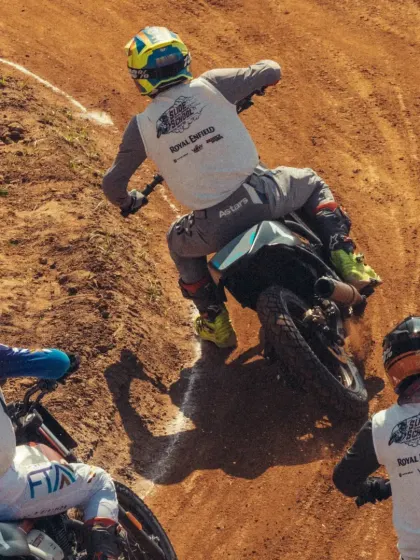 An overhead view of the intense, close-quarters racing at the Slide School Cup. Our riders are trained to be aggressive yet precise, even when battling for position on a challenging dirt track.