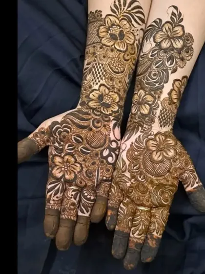 A stunning example of full-hand floral work, with different flower styles blended together seamlessly.