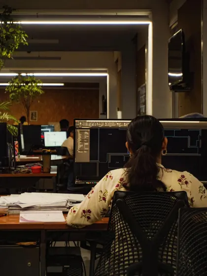 A glimpse into our design process, showing an architect working at her computer. It's a journey of ideas, collaboration, and problem-solving that happens behind every finished project.