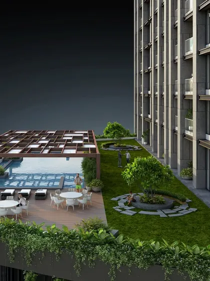 Another view of the rooftop amenity deck at our Bandra project. The space is designed as a quiet sanctuary, balancing a serene pool with landscaped lawns and seating areas for relaxation and social gatherings.