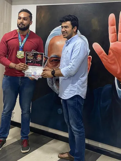 We formally recognize the hard work and achievements of our athletes. Here, Srinivas is honored for his brilliant performance and for making our nation proud.