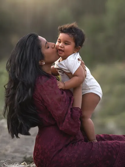 There's nothing sweeter than a baby's kiss. This candid moment of pure affection between Keertana and her little one is what family photography is all about for me.