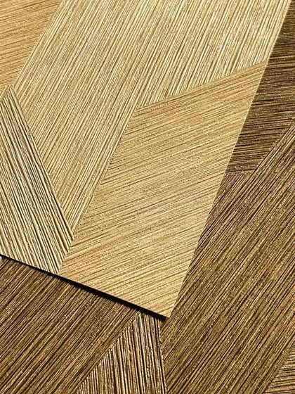This golden wallpaper features a beautiful, thread-like texture in a geometric pattern. It's a perfect example of how I blend elegance and opulence to transform a room into a sophisticated haven.