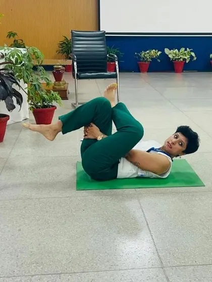 Demonstrating some simple stretches that can be done anywhere, even at a desk. Movement is key to staying healthy.