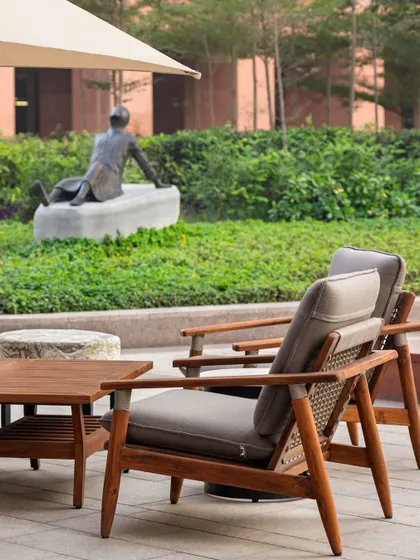An outdoor seating area at dusk, where design goes beyond walls to create connections and shape how we experience a space.
